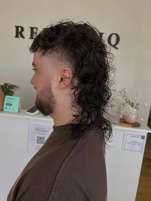 Zero fade, shaped curly mullet